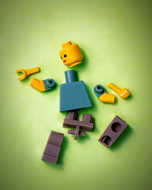 Lego character pulled into pieces. Photo by Jackson Simmer on Unsplash. Fix things!